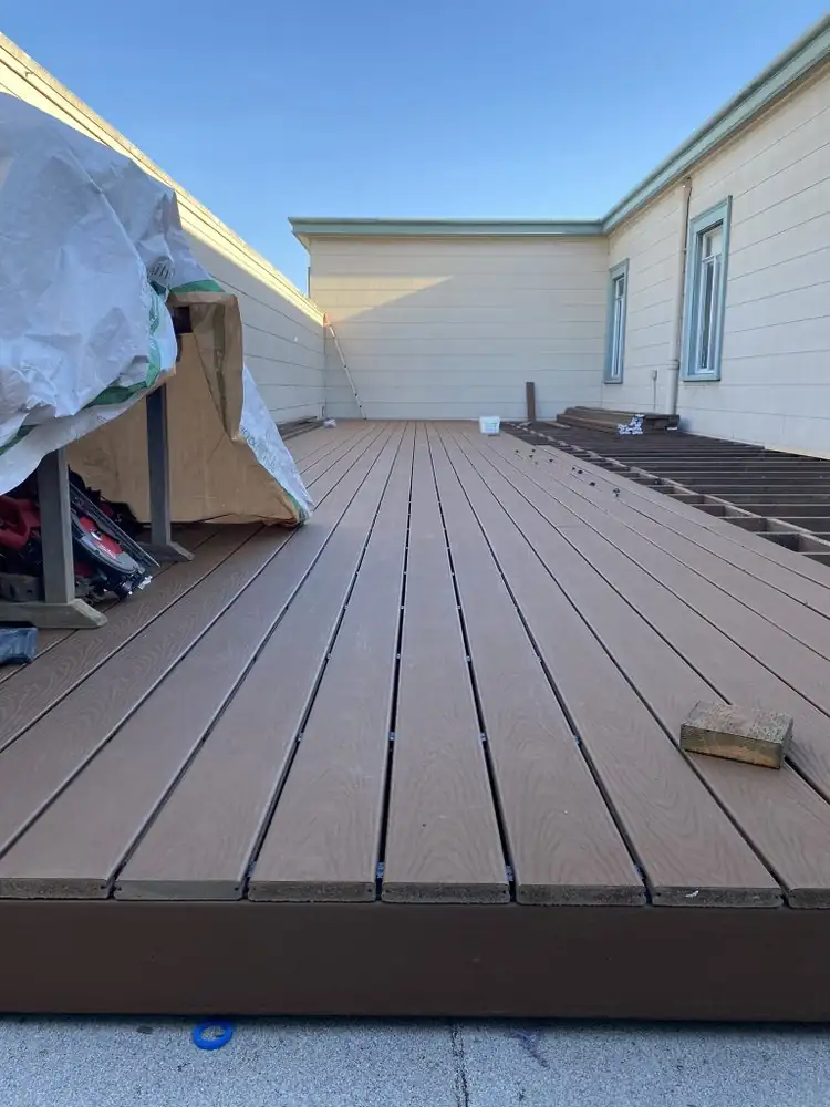 New deck boards being fitted over an exposed frame